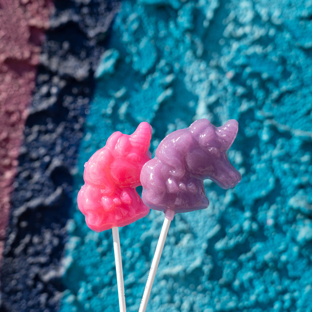 
            
                Load image into Gallery viewer, Sparkly Purple Unicorn Lollipops with Purple Glitter- Grape (24 Pieces) - Sparko Sweets
            
        
